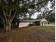 Charming single-story home featuring a two-car garage and tasteful landscaping at 11308 Echo View Dr, Odessa, FL 33556
