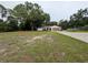 A well maintained home with a long driveway, an attached garage and a spacious yard at 11308 Echo View Dr, Odessa, FL 33556