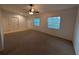 Cozy living room with neutral walls, updated windows and a ceiling fan at 11308 Echo View Dr, Odessa, FL 33556