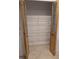Pantry closet with folding glass paneled doors and wire shelving at 11308 Echo View Dr, Odessa, FL 33556