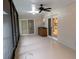Spacious covered patio features a ceiling fan, wet bar, and seamless access to indoor and outdoor areas, ideal for entertaining at 11308 Echo View Dr, Odessa, FL 33556