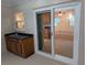 Outdoor patio features a convenient wet bar and a sliding glass door that opens to the living area for easy indoor-outdoor flow at 11308 Echo View Dr, Odessa, FL 33556