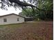 A view of the yard featuring the home's exterior and screened patio at 11308 Echo View Dr, Odessa, FL 33556