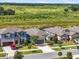 Neighborhood aerial view featuring a single Gathering home and green spaces in the surrounding area at 11745 Brighton Knoll Loop, Riverview, FL 33579