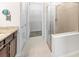 Bathroom featuring walk-in shower, and walk in closet at 11745 Brighton Knoll Loop, Riverview, FL 33579