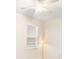 Bright bedroom featuring a large window, ceiling fan, and a lamp in the corner at 11745 Brighton Knoll Loop, Riverview, FL 33579
