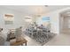 Formal dining area with coordinated blue and white decor, situated adjacent to the living area at 11745 Brighton Knoll Loop, Riverview, FL 33579