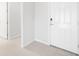 Clean entryway featuring white walls, and a white front door, with tile flooring at 11745 Brighton Knoll Loop, Riverview, FL 33579