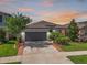 Charming single-Gathering home features a well-manicured lawn and a two-car garage at 11745 Brighton Knoll Loop, Riverview, FL 33579