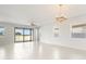 Bright and airy living area featuring tile flooring and sliding glass doors leading to the backyard at 11745 Brighton Knoll Loop, Riverview, FL 33579