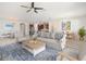 Inviting living area with stylish furniture and decor, flowing into the dining and kitchen areas at 11745 Brighton Knoll Loop, Riverview, FL 33579