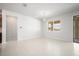 Bright and spacious living area with light tile flooring, and sliding glass doors at 11745 Brighton Knoll Loop, Riverview, FL 33579