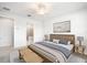 Comfortable main bedroom featuring a wooden bed frame, ensuite bath, and tasteful decorations at 11745 Brighton Knoll Loop, Riverview, FL 33579