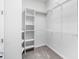 Walk-in closet with wire shelving and carpeted flooring for ample storage at 11745 Brighton Knoll Loop, Riverview, FL 33579