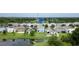 Aerial view of the community, featuring homes with backyard pond access and lush landscaping at 11926 Grand Kempston Dr, Gibsonton, FL 33534