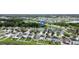 Expansive aerial view of a residential neighborhood with ponds and lush greenery at 11926 Grand Kempston Dr, Gibsonton, FL 33534