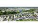 Aerial view of a residential area with homes, ponds, and lush greenery in a well-planned neighborhood at 11926 Grand Kempston Dr, Gibsonton, FL 33534