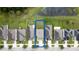 Aerial view of light-blue home with fenced backyard and view of a pond at 11926 Grand Kempston Dr, Gibsonton, FL 33534