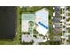 Aerial view of community amenities including pool, tennis courts, basketball court, and clubhouse at 11926 Grand Kempston Dr, Gibsonton, FL 33534