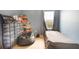 Bedroom with a window, ceiling fan, and blue walls at 11926 Grand Kempston Dr, Gibsonton, FL 33534
