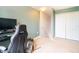 Bright, carpeted bedroom with closet and neutral walls, perfect for relaxation or home office at 11926 Grand Kempston Dr, Gibsonton, FL 33534