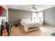 Comfortable bedroom featuring a ceiling fan, neutral walls, and bright natural light at 11926 Grand Kempston Dr, Gibsonton, FL 33534