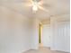 Bedroom with a ceiling fan, doorway, and carpeted floor at 11926 Grand Kempston Dr, Gibsonton, FL 33534