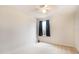 Bedroom with a window, ceiling fan, and light walls at 11926 Grand Kempston Dr, Gibsonton, FL 33534