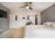 Bedroom with artwork, ceiling fan, and a storage bed at 11926 Grand Kempston Dr, Gibsonton, FL 33534