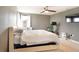 Neutral bedroom offering a ceiling fan, gray walls, and a storage bed at 11926 Grand Kempston Dr, Gibsonton, FL 33534