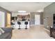 Open-concept living and kitchen area, great for entertaining and everyday living, with bar seating at 11926 Grand Kempston Dr, Gibsonton, FL 33534
