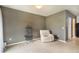 Cozy room with a recliner and birdcage, offering a peaceful space for relaxation or hobbies at 11926 Grand Kempston Dr, Gibsonton, FL 33534