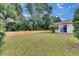 Large, grassy backyard with a new wooden fence and lush greenery at 1216 Fox Chapel Dr, Lutz, FL 33549