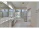 Bathroom with dual sinks, large vanity and plentiful natural light at 1216 Fox Chapel Dr, Lutz, FL 33549