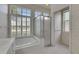 Bathroom featuring tub, shower, and natural light from multiple windows at 1216 Fox Chapel Dr, Lutz, FL 33549