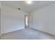 Bedroom featuring neutral carpet, large closet, and doorway providing access to the home at 1216 Fox Chapel Dr, Lutz, FL 33549