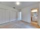 Spacious bedroom with carpet flooring, double closets, and an open doorway to a bathroom at 1216 Fox Chapel Dr, Lutz, FL 33549