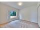 A bedroom with neutral carpet, a window, and a closet at 1216 Fox Chapel Dr, Lutz, FL 33549