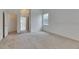 Bedroom featuring neutral tones, window and doorway to other rooms at 1216 Fox Chapel Dr, Lutz, FL 33549
