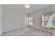 Cozy bedroom featuring two sunny windows and a closet at 1216 Fox Chapel Dr, Lutz, FL 33549