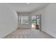 Bright bedroom featuring large window and access to outdoor area at 1216 Fox Chapel Dr, Lutz, FL 33549