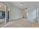 Bedroom with neutral carpet, sliding glass doors and access to other rooms at 1216 Fox Chapel Dr, Lutz, FL 33549