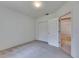 Spacious bedroom with soft carpet, closet and doorway leading to tiled room at 1216 Fox Chapel Dr, Lutz, FL 33549