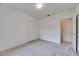 A bedroom featuring neutral carpet, large closet, and doorway providing access to the home at 1216 Fox Chapel Dr, Lutz, FL 33549