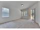 Well-lit bedroom with sliding glass doors to outdoor patio at 1216 Fox Chapel Dr, Lutz, FL 33549