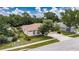 Beautiful home with mature landscaping, a three-car garage, and well-maintained lawn at 1216 Fox Chapel Dr, Lutz, FL 33549