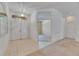 Bright foyer with tile flooring, double entry doors, and an arched transom window offers a welcoming entrance at 1216 Fox Chapel Dr, Lutz, FL 33549