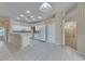 Bright kitchen featuring white appliances and easy access to entry and living area at 1216 Fox Chapel Dr, Lutz, FL 33549