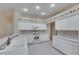 Bright kitchen with white cabinets, appliances and tiled flooring, offering a clean and functional space at 1216 Fox Chapel Dr, Lutz, FL 33549