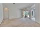 Bright living room with sliding door access to the screened lanai, perfect for relaxing and entertaining at 1216 Fox Chapel Dr, Lutz, FL 33549